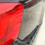 Before and after photographs of a damaged black Volkswagon Jetta that was repaired by Elite Paint & Body Shop in West Palm Beach, Florida.